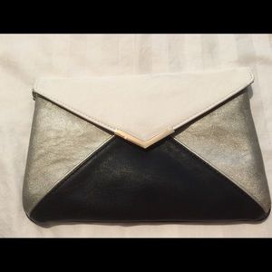 Clutch, multi color. Black, white, silver.